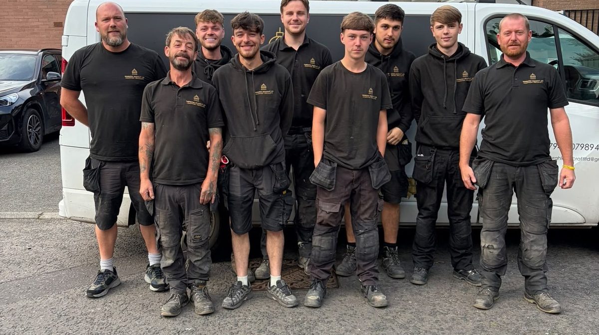 The nine strong Edinburgh Leadcraft team in front of a company van, Edinburgh Trusted Trader member